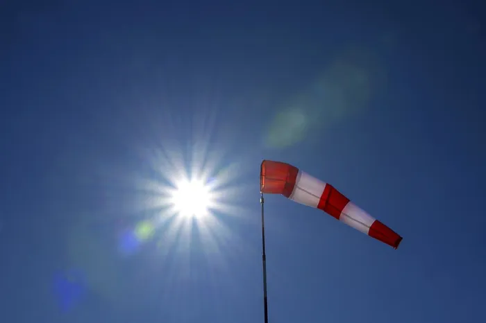 Framed Print : Windsock Print with Sun Star against Light Blue Sky, Bavaria Framed Print : Windsock Print with Sun Star against Light Blue Sky, Bavaria