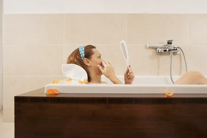 Framed Print : Woman Checking Expression Lines While Bathing Print