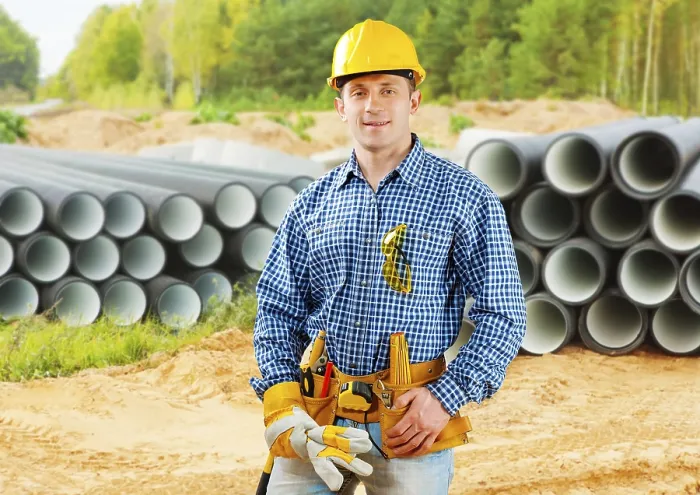 Framed Print : Worker near stack of big pipes Print Framed Print : Worker near stack of big pipes Print