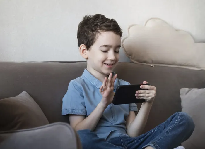 Framed Print : Cozy Home Scene Print: Boy with Smartphone Framed Print : Cozy Home Scene Print: Boy with Smartphone