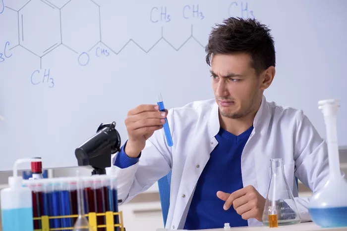 Framed Print : Young Chemist Sitting in Lab Print Framed Print : Young Chemist Sitting in Lab Print