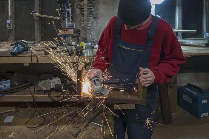 Framed Print : Young Man at a Flex in his Workshop Print Framed Print : Young Man at a Flex in his Workshop Print
