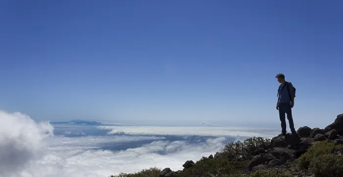 Framed Print : La Palma Landscape Print: Young Man Across Clouds