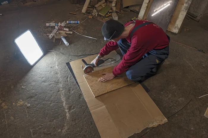 Framed Print : Young Man Working with Angle Grinder Print, Germany Framed Print : Young Man Working with Angle Grinder Print, Germany