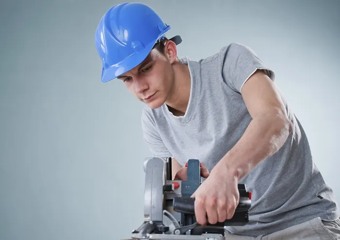 Framed Print : Young Tradesman Using a Jigsaw Print Framed Print : Young Tradesman Using a Jigsaw Print