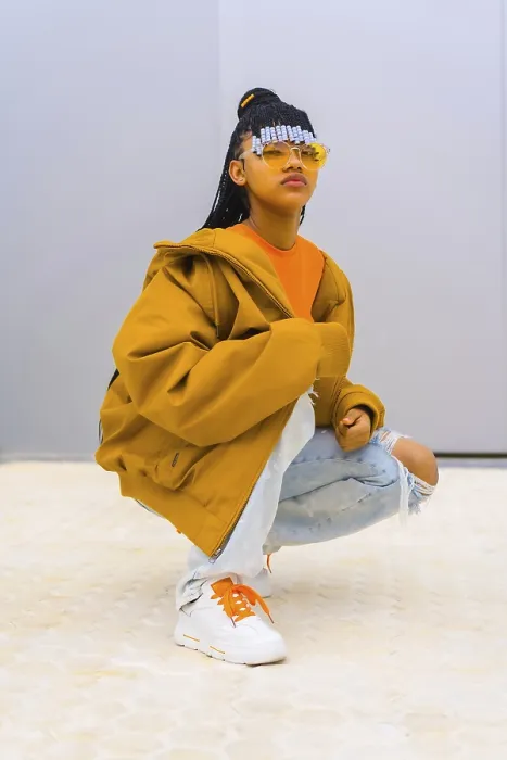 Framed Print : A Young Trap Dancer Print with Braids and Orange Sunglasses Framed Print : A Young Trap Dancer Print with Braids and Orange Sunglasses