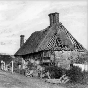 Print of a half-timbered cottage in disrepair
