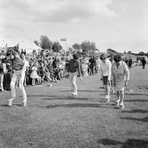 Print of Women Competing in a Flower Pot Race at Laing Sports Day Print of Women Competing in a Flower Pot Race at Laing Sports Day