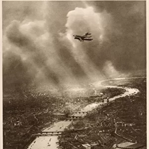 Amazing aerial photograph looking east over London, in the farthest distance the river
