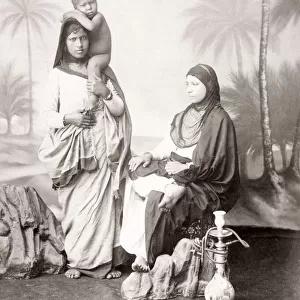 Two arab women with child, hookah pipe, Egypt, c. 1890