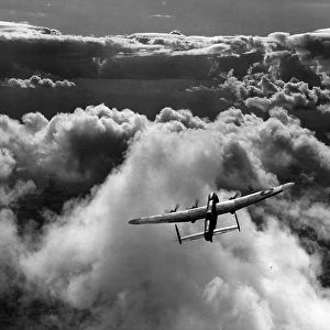 Avro Lancaster II flying above cloud