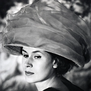 Beautiful woman wearing Cecil Beaton-style hat