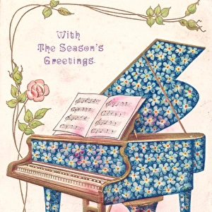 Blue flowers on a piano on a Christmas postcard