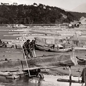 Boat builders in a shipyard, Hong Kong, c. 1900