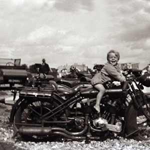 Boy on a 1924 Coventry Eagle motorcycle