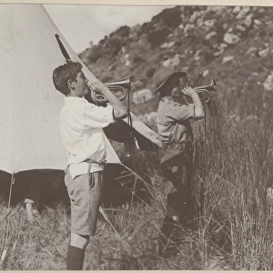 Two boy scout buglers at camp