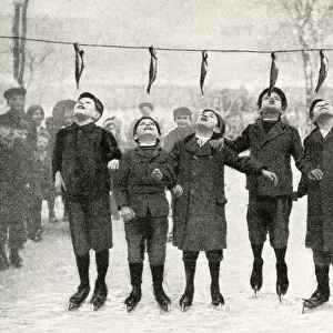 Boys jumping for herrings, Danzig (now Gdansk, Poland)