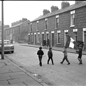Boys in a street with a flag, Belfast, Northern Ireland