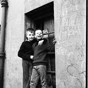 Boys on a window ledge, Belfast, Northern Ireland