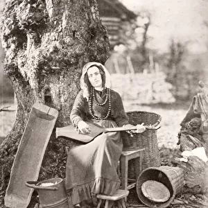 Caucasus Georgia - Georgian woman with a musical instrument