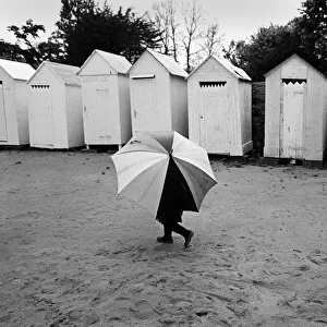 Child with umbrella, Brittany, France