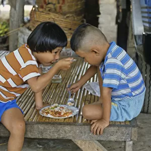 Children sharing a meal, Bangkok