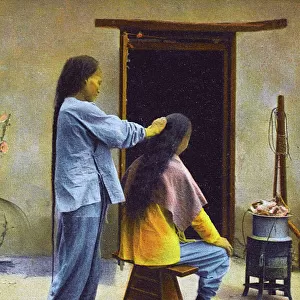 China - A Chinese Barber, preparing a long pigtail