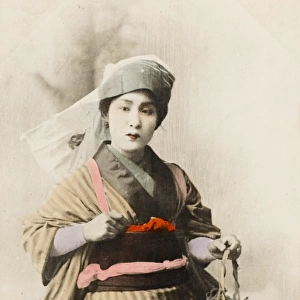 Chinese Woman carrying a plant
