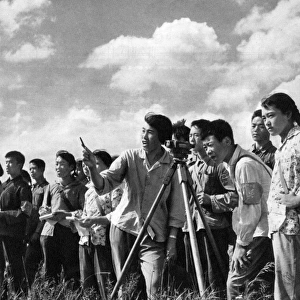 Communist China - surveying in a field