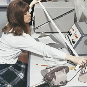 A computer technician with data tape