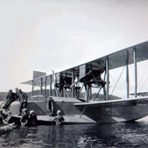 Curtiss H-16 (forward view) at mooring with crewmen