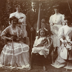 The Dalrymple Orchestra, photographed in a garden