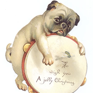 Dog with tambourine on a cutout Christmas card