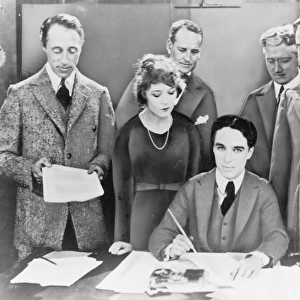 DW Griffith, Mary Pickford, Charlie Chaplin (seated) and Dou