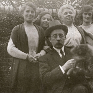 Family group with dog in a garden