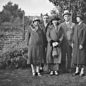 Family group of five in a garden
