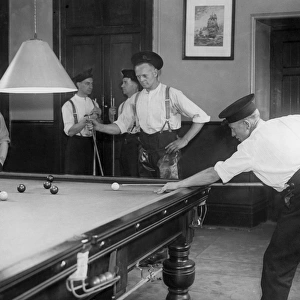 Firefighters playing billiards in fire station