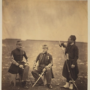 Two French officers, seated, and Zouave, standing with arm r