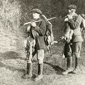 Two gamekeepers carrying pheasants and hares