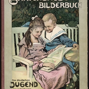 Girl and boy reading on a bench