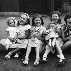 Girls with their dolls in a Balham street, SW London