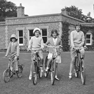 Four girls riding bicycles