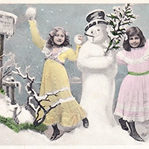 Two girls with snowman on a Christmas postcard