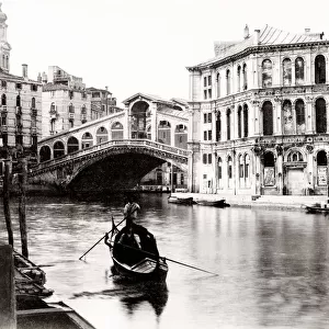 Gondola in the canal in front of the Rialto Bridge, Venice