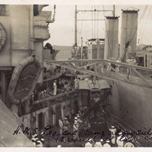 HMS Pegasus alongside HMS Marlborough recovering seaplane