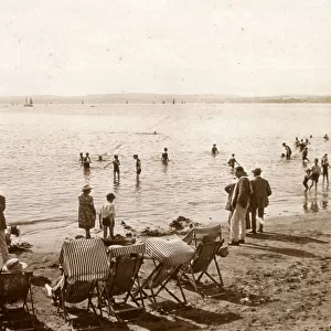 Holidaymakers on the beach at Torquay, Devon