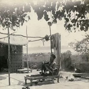 Indian fakir or holy man lying on a bed of nails, India
