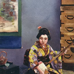 Japanese Geisha playing a Traditional Shamisen