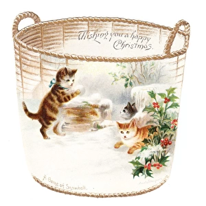 Three kittens snowballing on a cutout Christmas card