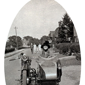 Lady sitting in veteran 1920s motorcycle sidecar